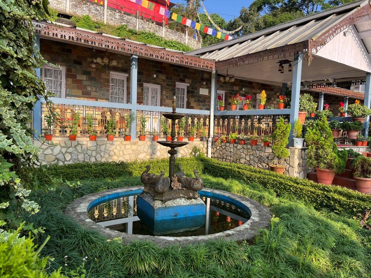 Heritage fountain and verandah at Saino Heritage Bungalow