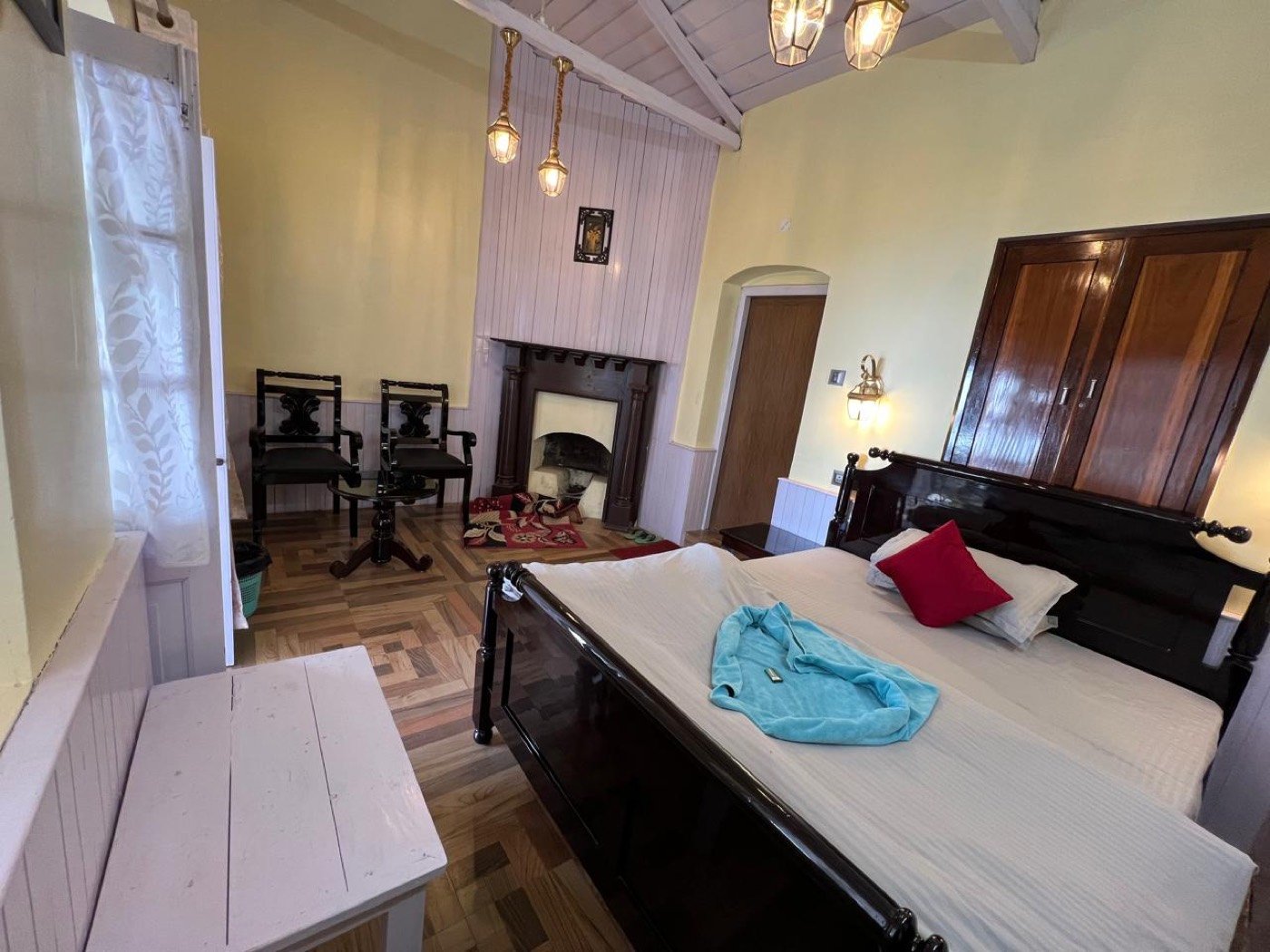 Deluxe Double heritage room with fireplace at Saino Heritage Bungalow